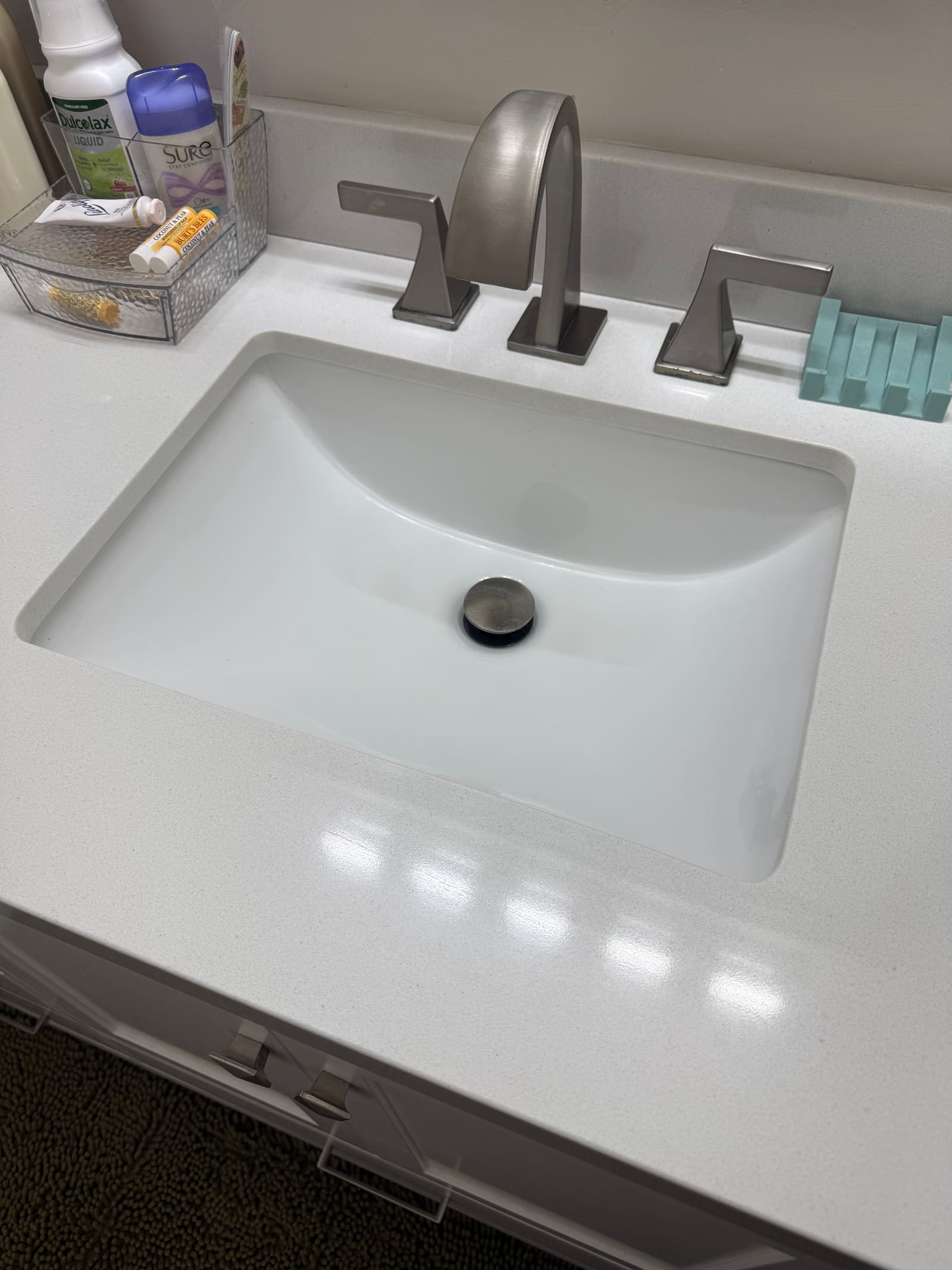 Close-up of a clean bathroom sink and fixtures.