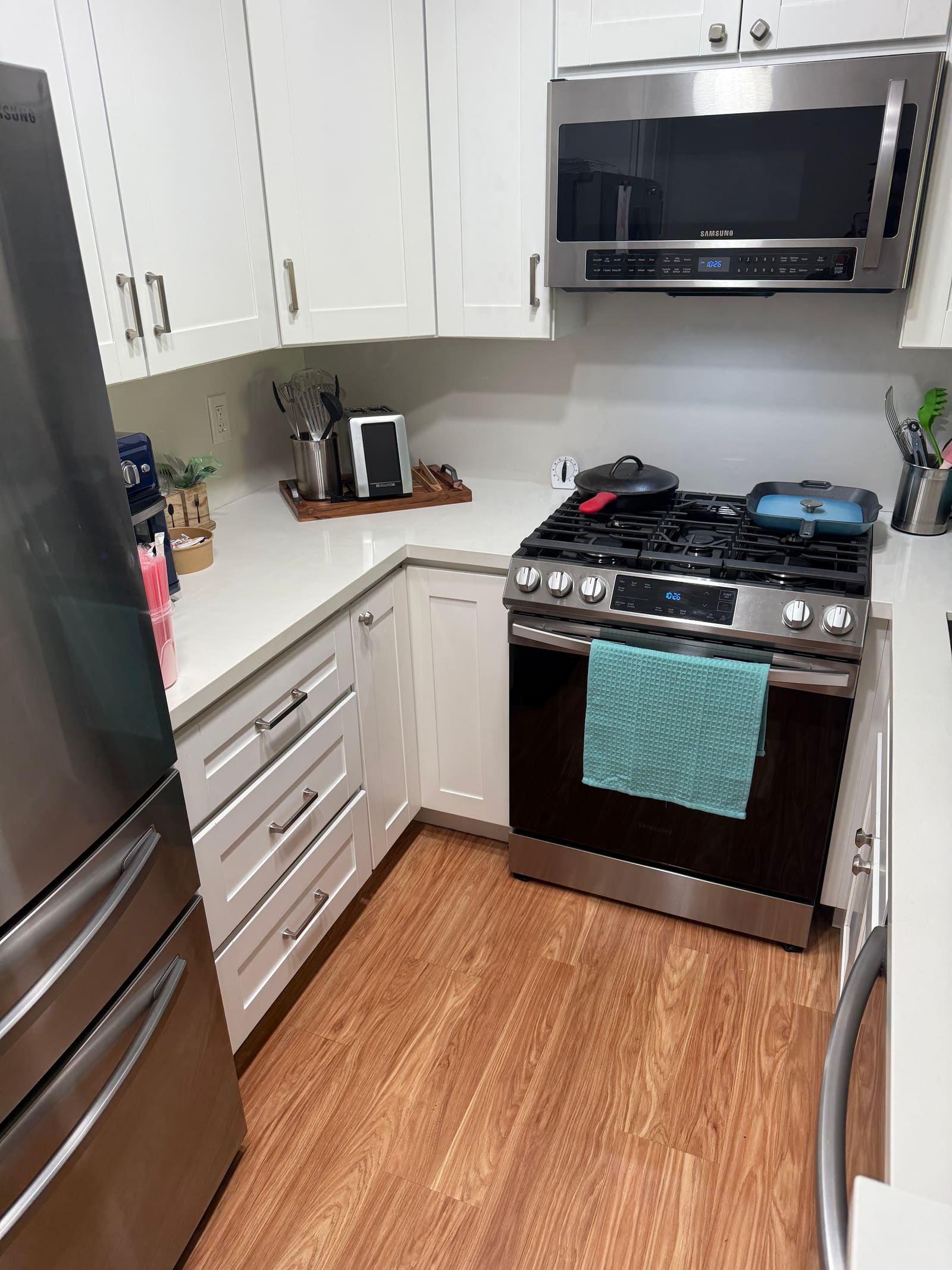 Modern kitchen with stainless appliances, kept spotless by Melvie's.