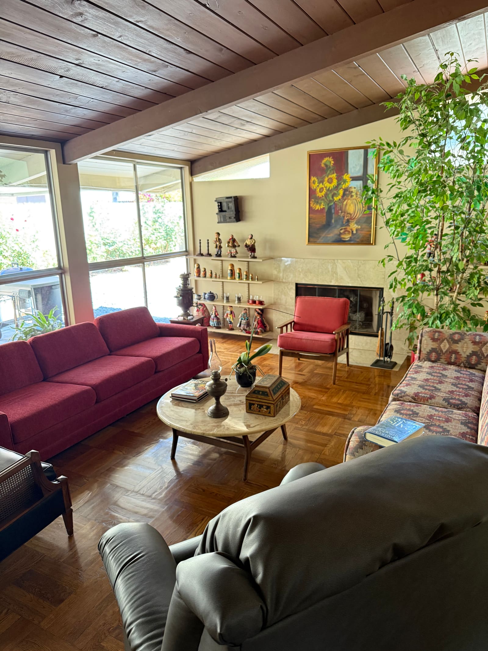 Bright, tidy sunroom living area.